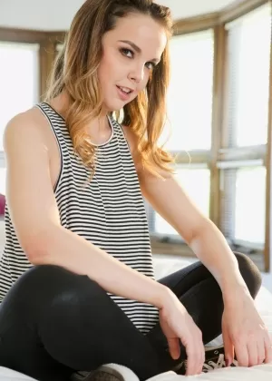 Young hottie Dillion Harper uncovers her big natural breasts on a bed