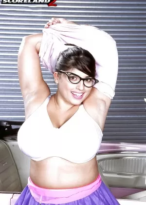 Glasses wearing European BBW Kerry Marie exposing huge MILF tits in office