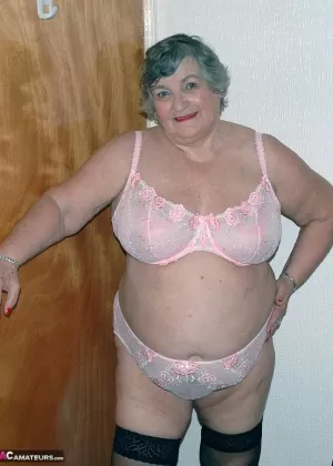 Obese old woman Grandma Libby masturbates on her bed in stockings