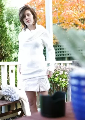 Amateur babe Brandy removing her bra and panties outdoors as seen by voyeur