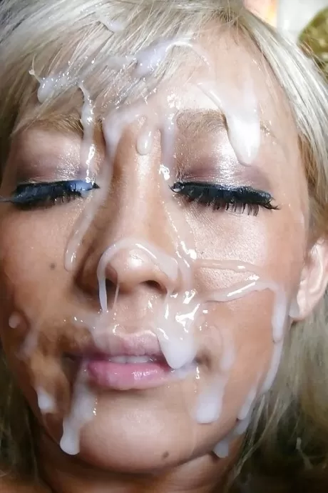 Blonde Jap chick Rina Aina taking jizz on face during bukkake session