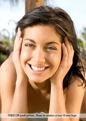 Totally naked girl Laila strikes great poses while visiting a nude beach