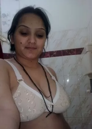 Overweight Indian student shows her bare mid-section in a brassiere