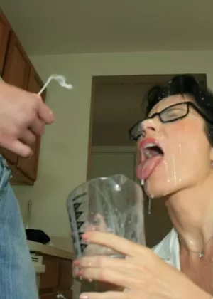 Slutty mature brunette in glasses gives a blowjob and gets bukkaked