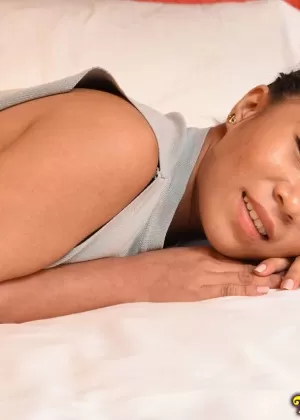 Busty Filipina girl takes a cumshot on her boobs after sex on a bed