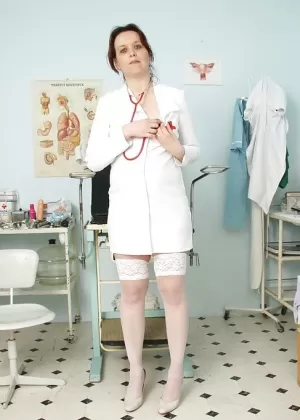 Naughty mature nurse with hairy cunt has no lingerie under her uniform