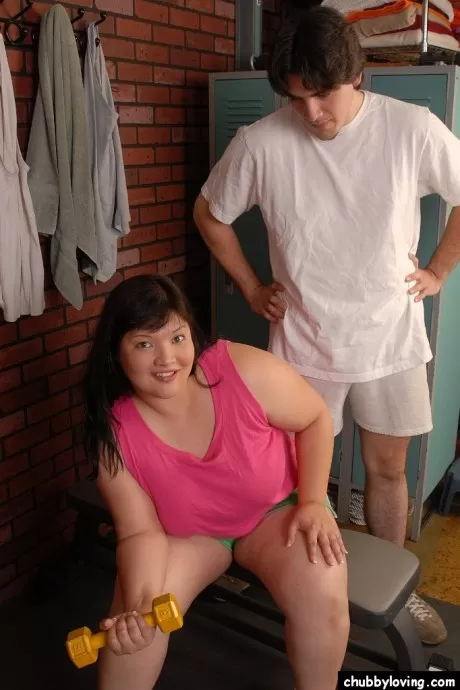 Asian fatty Olivia strips off shirt to reveal big all natural breasts