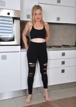Over 30 blonde Andrea Ann removes spandex leisure wear to get naked
