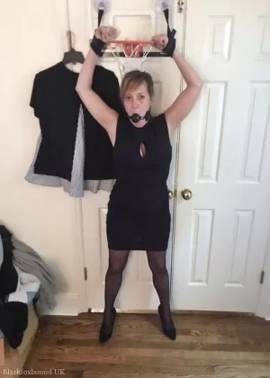 Mature lady Meyer is fitted with a ball gag and nipple clamps while restrained