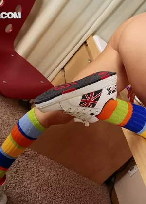 Solo girl Dasha gets naked in multi-colored knee socks and sneakers