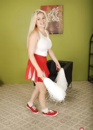 Buxom blonde cheerleader Prudence Pond baring large natural tits