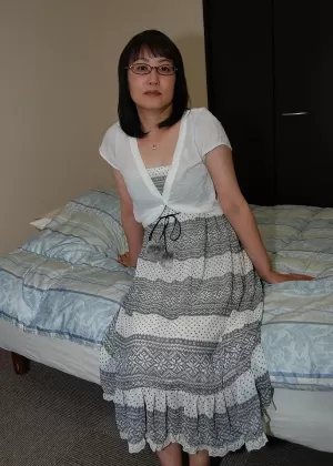 Shy asian lady in glasses strips down and has some pussy vibing fun